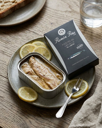 Ramon Pena mackerel fillets in lemon olive oil, tin on marble surface